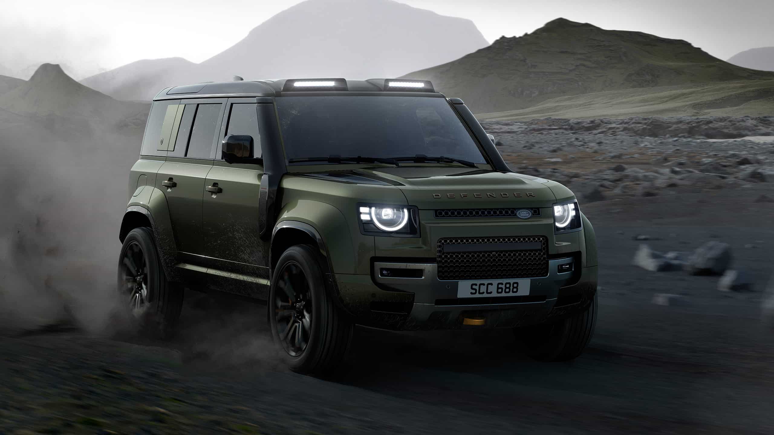 Defender runninng on sand dust road